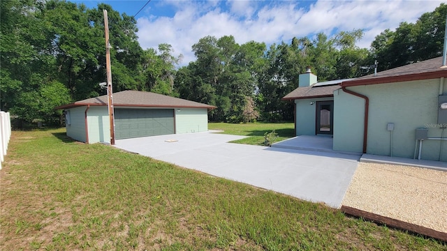 122 N Cedarview Ter, Inverness, FL 34453 - view of green lawn featuring a detached garage and an outbuilding