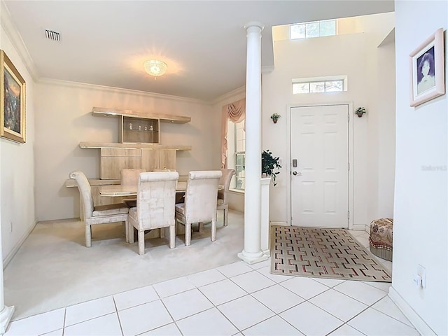 7323 Cypress Grove Rd Unit 87, Orlando, FL 32819 - tiled dining room with carpet floors, ornamental molding, and ornate columns
