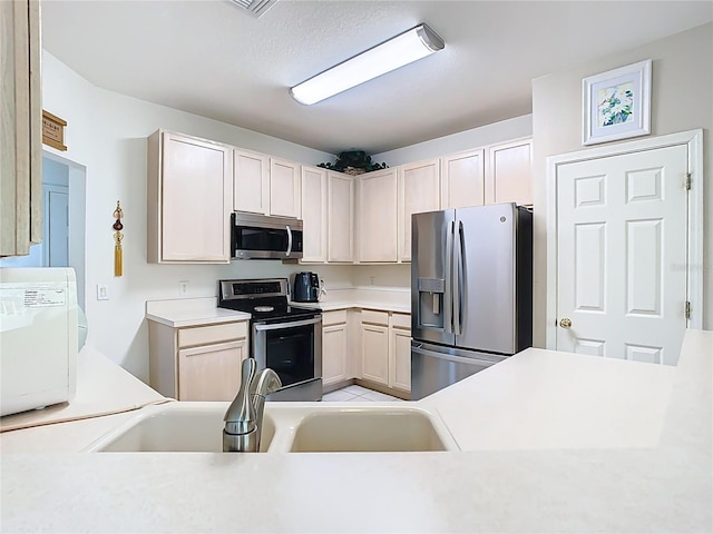 7323 Cypress Grove Rd Unit 87, Orlando, FL 32819 - kitchen featuring appliances with stainless steel finishes, a sink, and light countertops