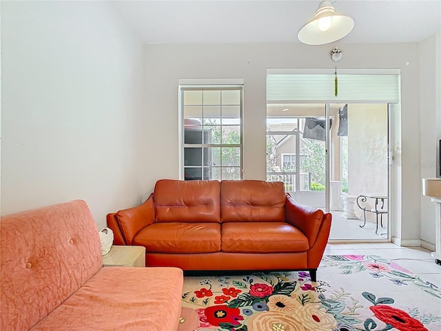 7323 Cypress Grove Rd Unit 87, Orlando, FL 32819 - living room with light tile patterned floors