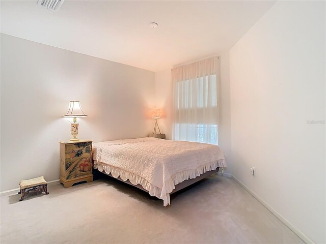 7323 Cypress Grove Rd Unit 87, Orlando, FL 32819 - bedroom with carpet and baseboards