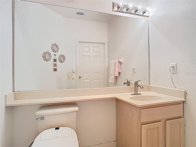 7323 Cypress Grove Rd Unit 87, Orlando, FL 32819 - half bath featuring vanity and toilet