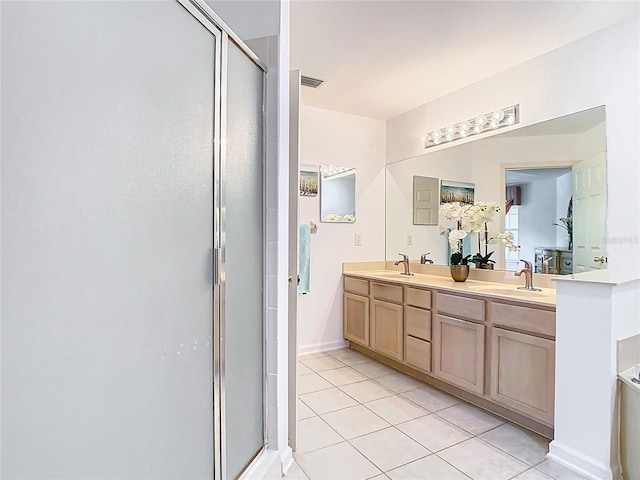 7323 Cypress Grove Rd Unit 87, Orlando, FL 32819 - full bath featuring tile patterned flooring, a stall shower, and double vanity