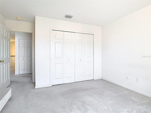 7323 Cypress Grove Rd Unit 87, Orlando, FL 32819 - unfurnished bedroom with carpet, baseboards, and a closet