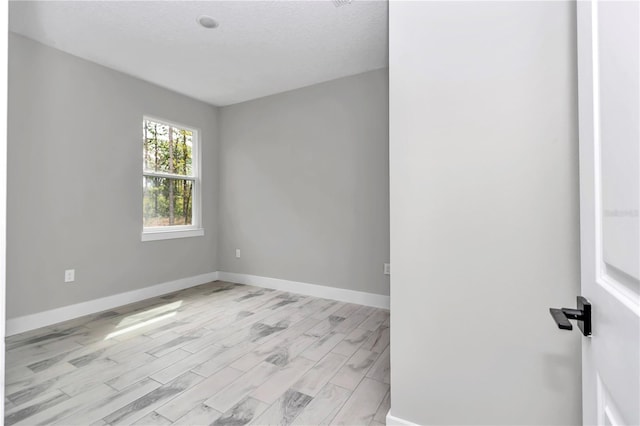 6805 SW 131st Cir, Ocala, FL 34481 - unfurnished room with baseboards and light wood-style floors
