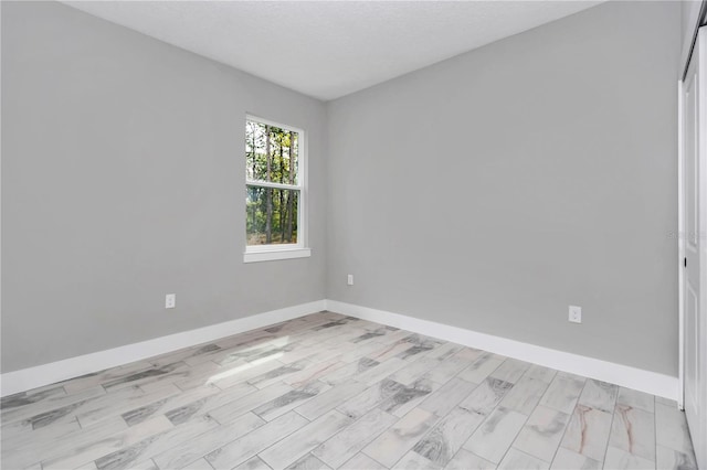 6805 SW 131st Cir, Ocala, FL 34481 - unfurnished room featuring baseboards and light wood-style floors