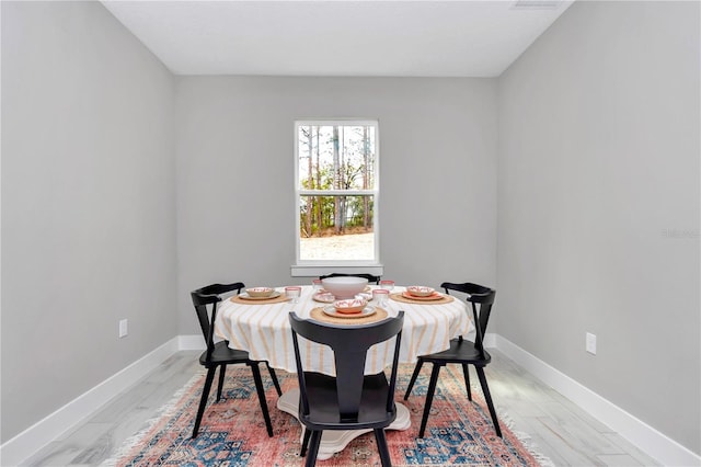 6805 SW 131st Cir, Ocala, FL 34481 - dining space with baseboards and light wood-style flooring