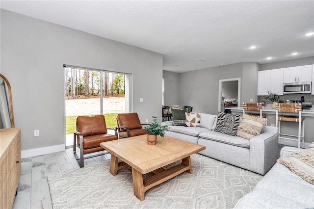 6805 SW 131st Cir, Ocala, FL 34481 - living room with recessed lighting, baseboards, and light marble finish floors