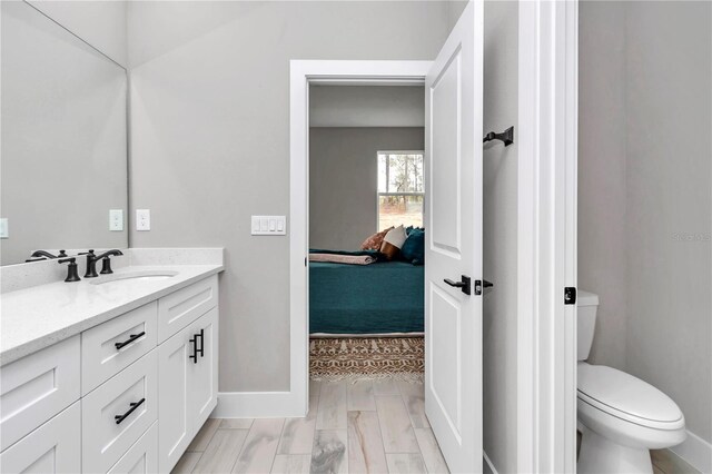 6805 SW 131st Cir, Ocala, FL 34481 - full bath with connected bathroom, baseboards, toilet, and vanity