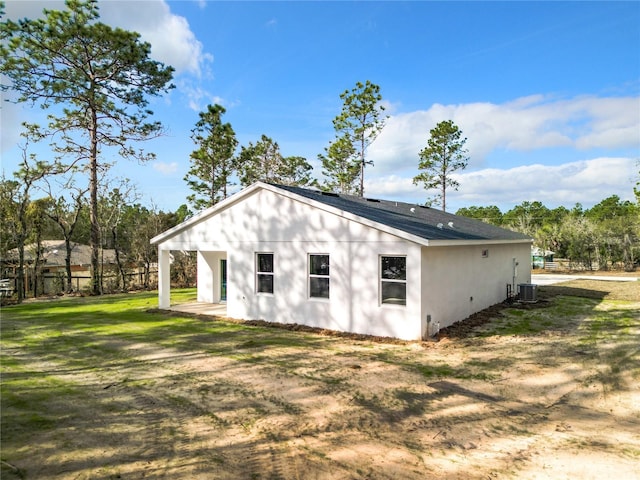 6805 SW 131st Cir, Ocala, FL 34481 - view of home's exterior featuring central air condition unit and stucco siding