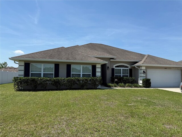 6800 SE 12th Pl, Ocala, FL 34472 - ranch-style home with an attached garage, driveway, a shingled roof, and stucco siding