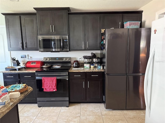 6800 SE 12th Pl, Ocala, FL 34472 - kitchen with stainless steel appliances, light tile patterned floors, and light stone countertops