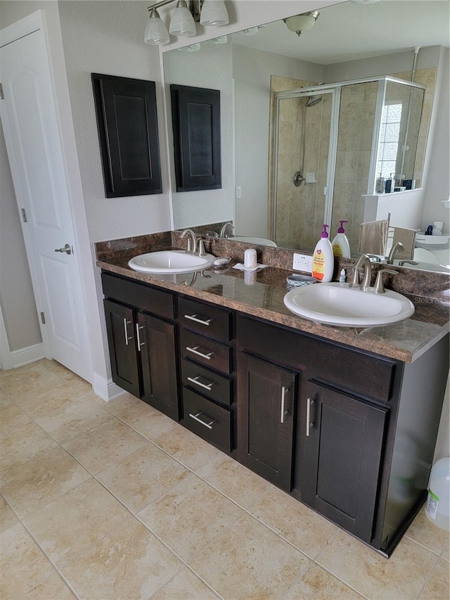 6800 SE 12th Pl, Ocala, FL 34472 - bathroom featuring a stall shower, double vanity, and tile patterned flooring