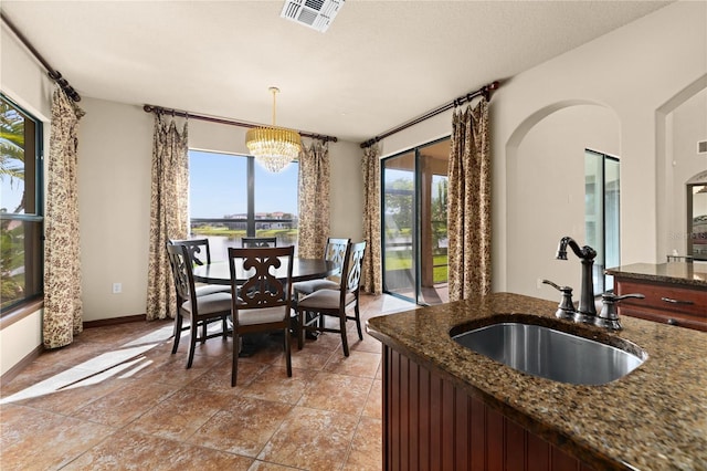 3041 Boating Blvd, Kissimmee, FL 34746 - dining space with a chandelier