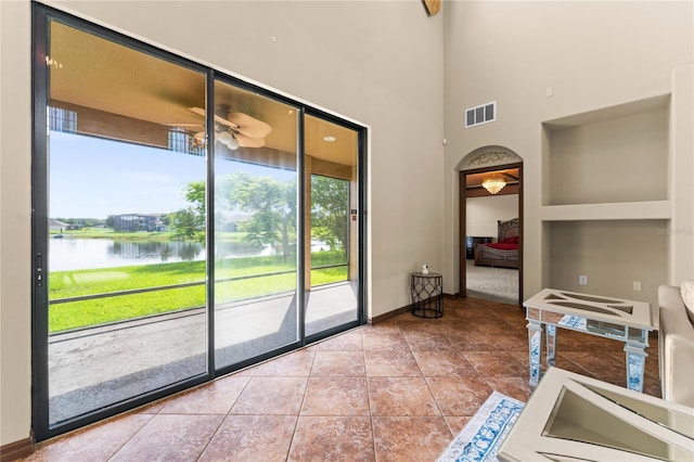 3041 Boating Blvd, Kissimmee, FL 34746 - doorway featuring a water view, baseboards, and arched walkways