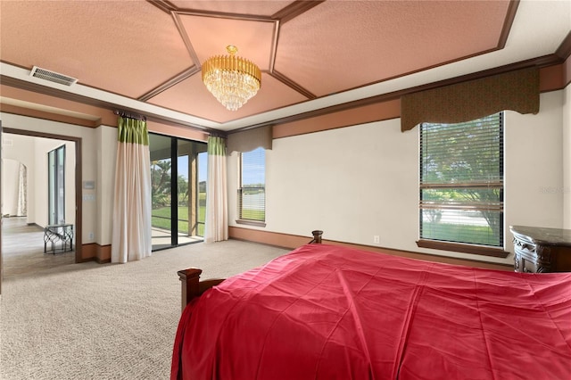 3041 Boating Blvd, Kissimmee, FL 34746 - carpeted bedroom featuring access to exterior, a chandelier, and a textured ceiling