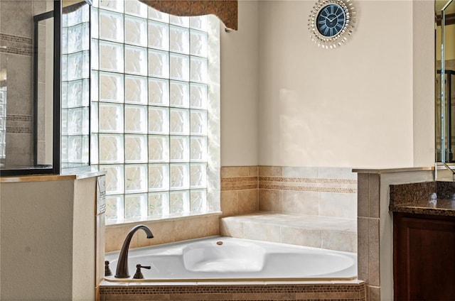 3041 Boating Blvd, Kissimmee, FL 34746 - bathroom featuring tiled shower, a bath, and vanity