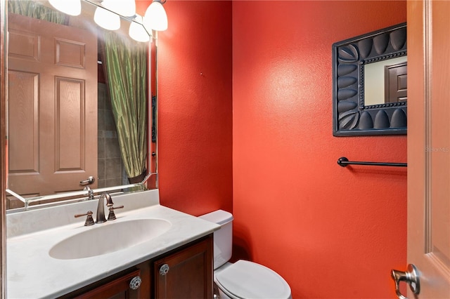 3041 Boating Blvd, Kissimmee, FL 34746 - bathroom featuring toilet, a textured wall, and vanity