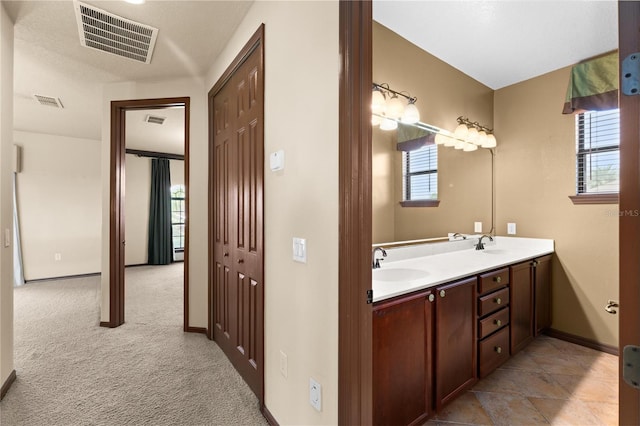 3041 Boating Blvd, Kissimmee, FL 34746 - bathroom with double vanity and baseboards