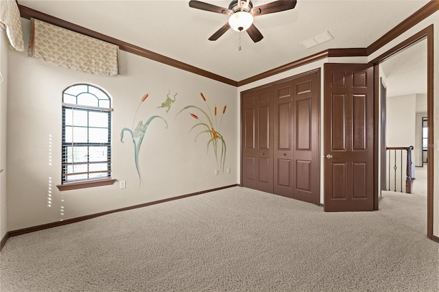 3041 Boating Blvd, Kissimmee, FL 34746 - unfurnished bedroom featuring carpet, a closet, baseboards, and ornamental molding