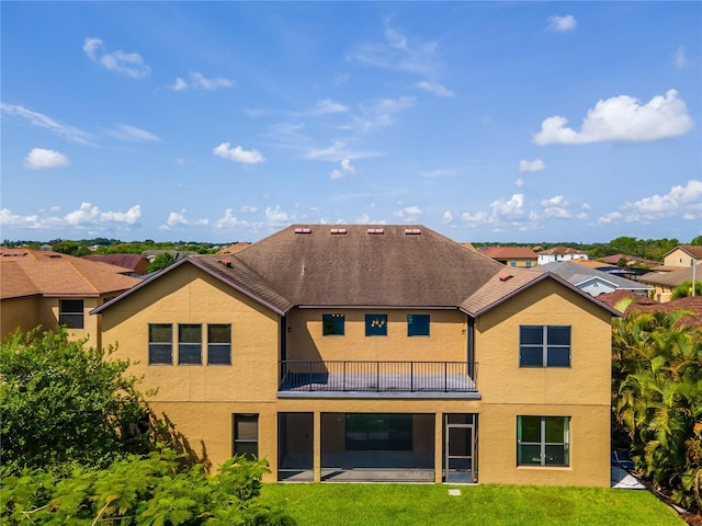 3041 Boating Blvd, Kissimmee, FL 34746 - back of house with stucco siding, a lawn, and a patio area