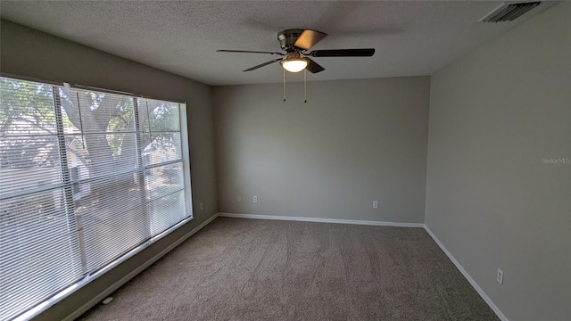 609 Whittingham Pl, Lake Mary, FL 32746 - carpeted spare room featuring a ceiling fan, baseboards, and a textured ceiling