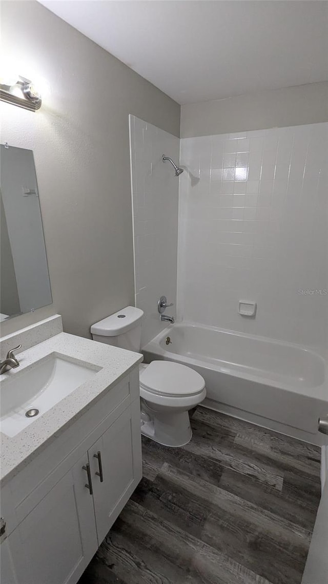 609 Whittingham Pl, Lake Mary, FL 32746 - full bathroom with wood finished floors, toilet, vanity, and bathtub / shower combination