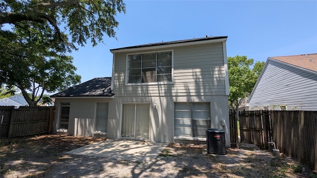 609 Whittingham Pl, Lake Mary, FL 32746 - rear view of property featuring a fenced backyard, stucco siding, and a patio area