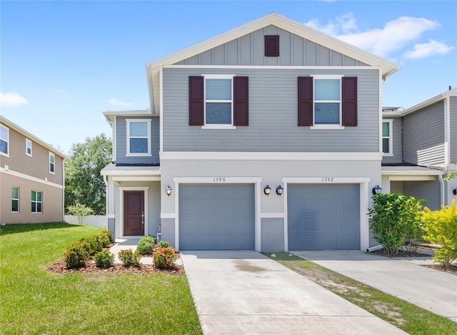 1396 Mirabella Cir, Davenport, FL 33897 - view of front facade featuring a front yard, board and batten siding, concrete driveway, an attached garage, and stucco siding
