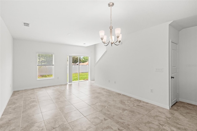 1396 Mirabella Cir, Davenport, FL 33897 - spare room featuring a chandelier, light tile patterned floors, and baseboards