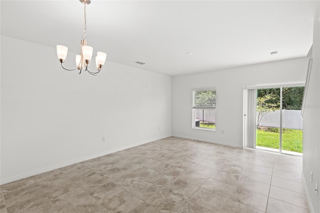 1396 Mirabella Cir, Davenport, FL 33897 - unfurnished room featuring a chandelier, light tile patterned floors, and baseboards