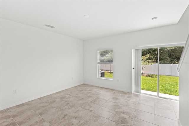 1396 Mirabella Cir, Davenport, FL 33897 - spare room featuring light tile patterned flooring and baseboards