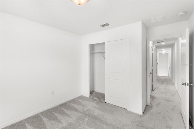 1396 Mirabella Cir, Davenport, FL 33897 - unfurnished bedroom featuring light colored carpet, a closet, and baseboards