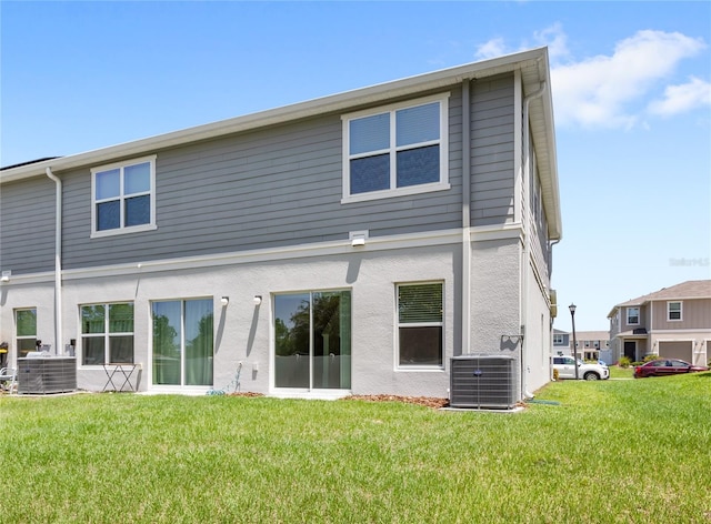 1396 Mirabella Cir, Davenport, FL 33897 - rear view of house with cooling unit and a yard