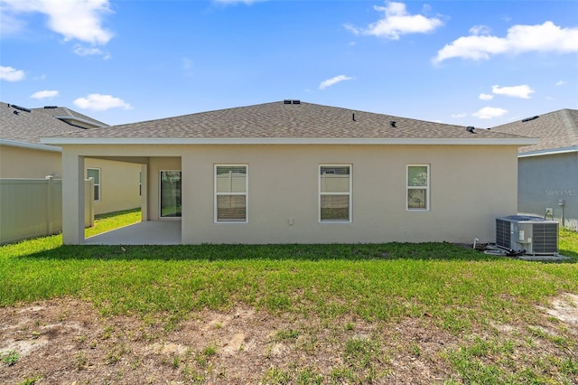 9356 St Therese St, Groveland, FL 34736 - rear view of house featuring cooling unit, a patio area, roof with shingles, and stucco siding