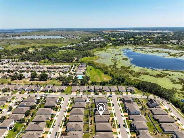 9356 St Therese St, Groveland, FL 34736 - aerial perspective of suburban area with a nearby body of water
