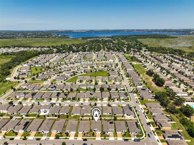 9356 St Therese St, Groveland, FL 34736 - aerial perspective of suburban area with a large body of water