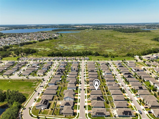 9356 St Therese St, Groveland, FL 34736 - aerial perspective of suburban area featuring a large body of water