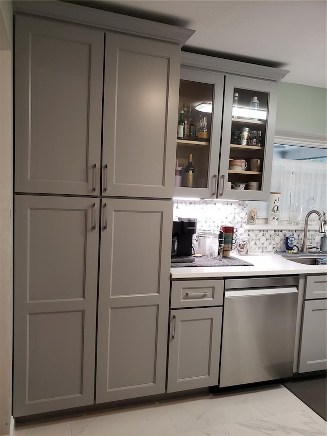 983 Bucksaw Pl, Longwood, FL 32750 - bar area with dishwasher, a sink, light marble finish flooring, and backsplash