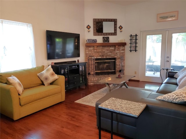 983 Bucksaw Pl, Longwood, FL 32750 - living room featuring wood finished floors, a brick fireplace, and french doors