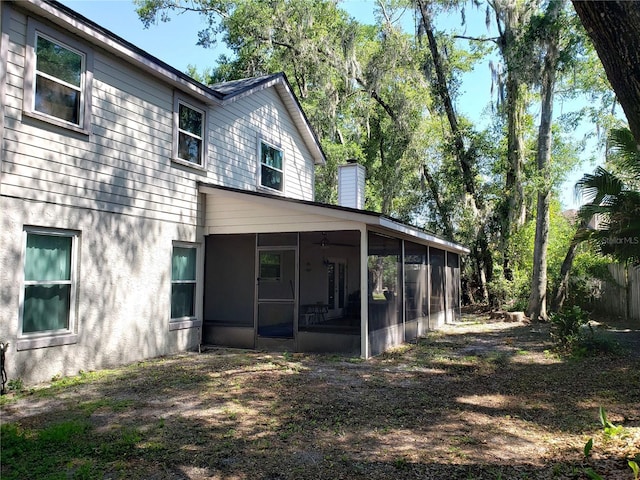 983 Bucksaw Pl, Longwood, FL 32750 - rear view of property featuring a sunroom and a chimney