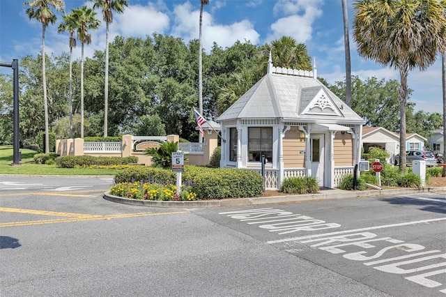 2714 Moncayo Ave, The Villages, FL 32162 - view of building exterior with view of wooded area and uncovered parking