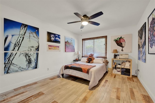 8248 Limetree Ct, Orlando, FL 32836 - bedroom featuring light wood-style flooring, baseboards, and a ceiling fan