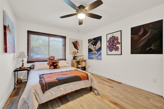 8248 Limetree Ct, Orlando, FL 32836 - bedroom featuring wood finished floors, baseboards, and a ceiling fan