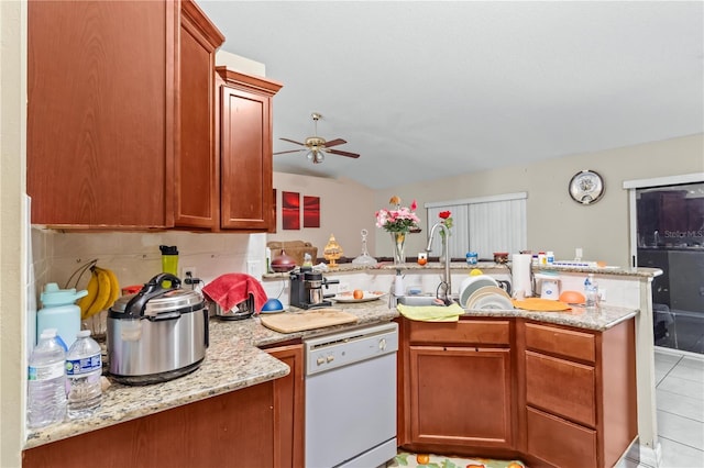 14 Sequoia Way, Kissimmee, FL 34758 - kitchen with dishwasher, a peninsula, ceiling fan, and light stone countertops