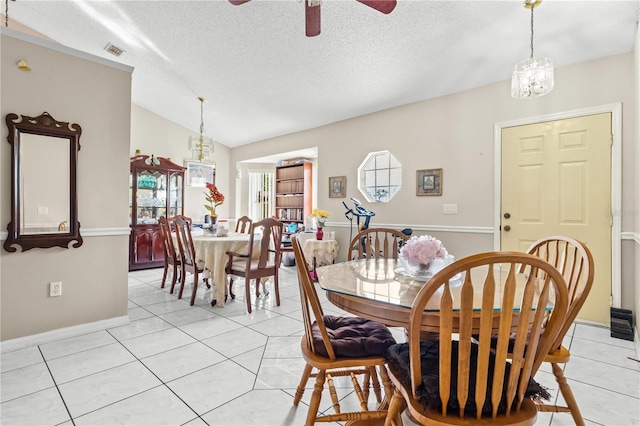 14 Sequoia Way, Kissimmee, FL 34758 - dining area featuring a ceiling fan, lofted ceiling, light tile patterned floors, a textured ceiling, and baseboards