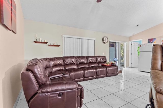 14 Sequoia Way, Kissimmee, FL 34758 - living room with lofted ceiling, a textured ceiling, and light tile patterned floors