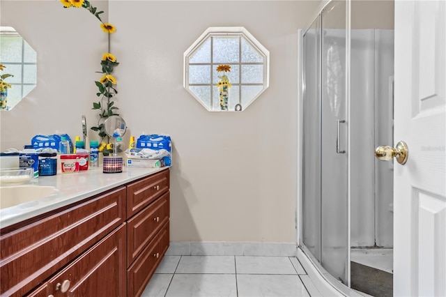 14 Sequoia Way, Kissimmee, FL 34758 - bathroom featuring a stall shower, vanity, tile patterned floors, and baseboards