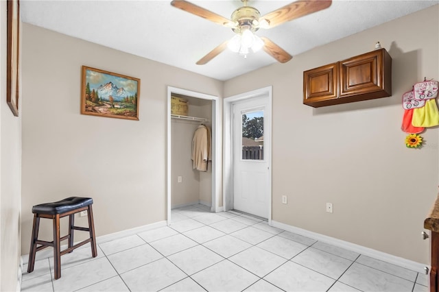 14 Sequoia Way, Kissimmee, FL 34758 - unfurnished bedroom with a closet, light tile patterned floors, baseboards, and a ceiling fan