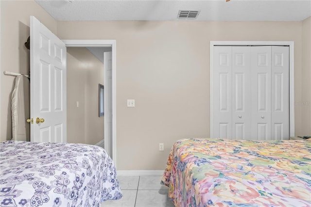 14 Sequoia Way, Kissimmee, FL 34758 - bedroom featuring a closet, baseboards, and light tile patterned floors
